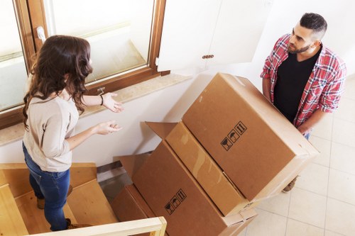 Careful loading of household items into a removal truck