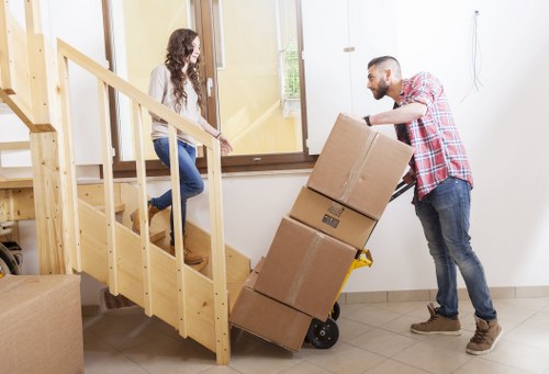 Loading furniture into a van in a St Johns Wood street