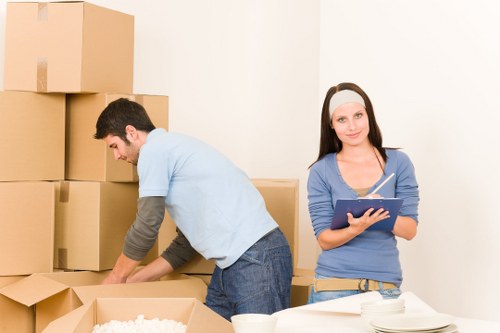 Professional movers handling office equipment and archives