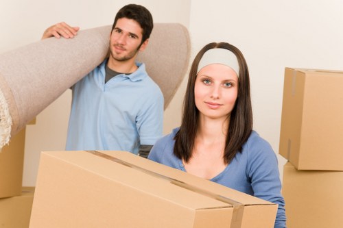 Packed office boxes and labelled equipment ready for a business move